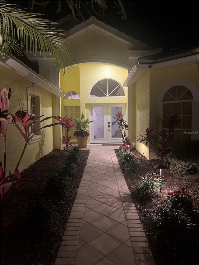 exterior entry at night with french doors