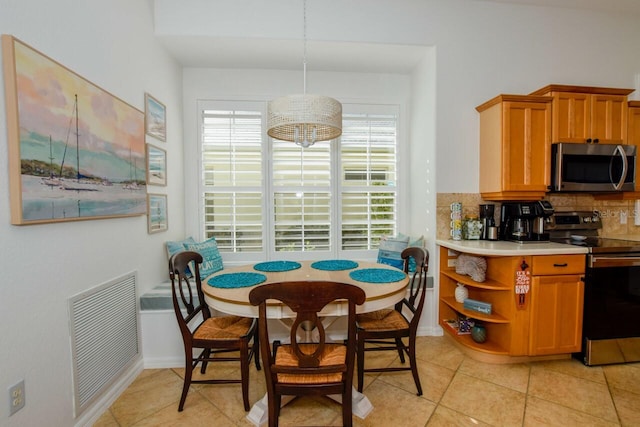 dining area with light tile patterned flooring