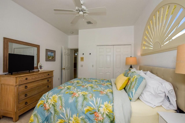 bedroom with carpet flooring, ceiling fan, and a closet