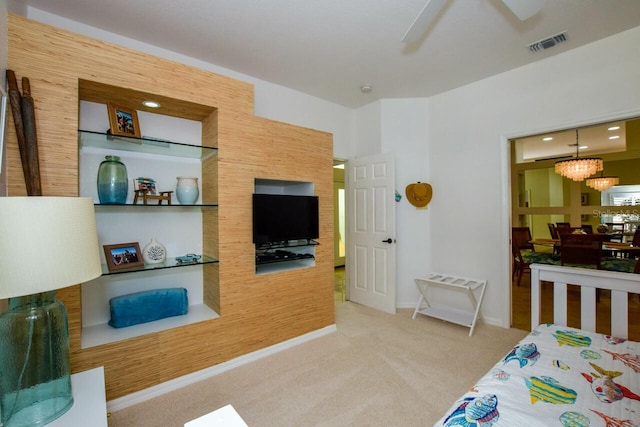 bedroom with ceiling fan and light colored carpet