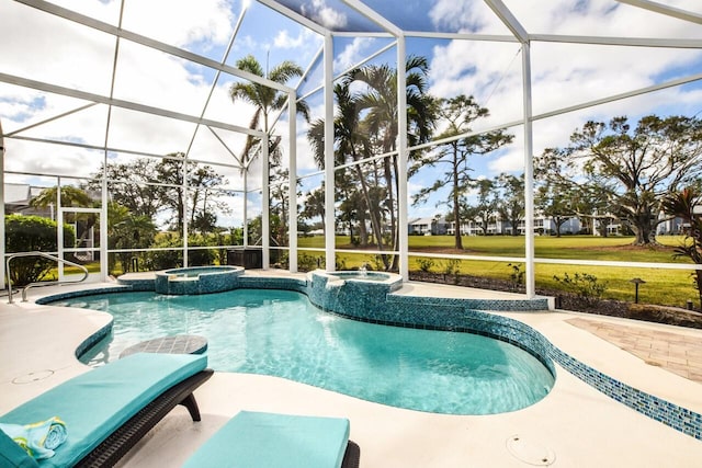 view of swimming pool featuring an in ground hot tub, a lanai, and a patio