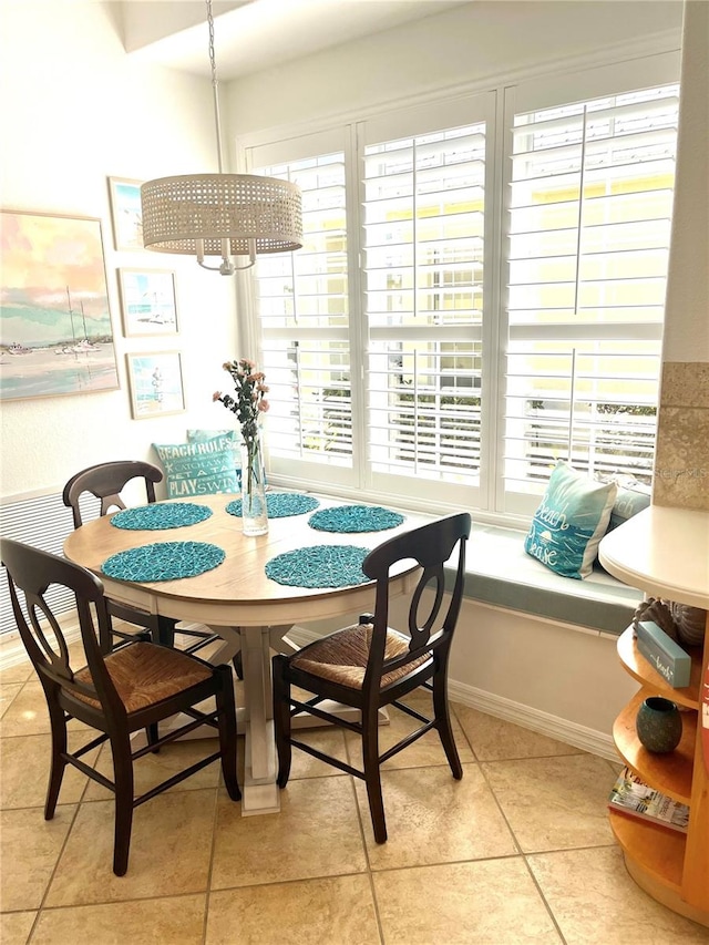 dining space with light tile patterned floors