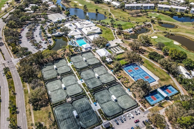 birds eye view of property with a water view