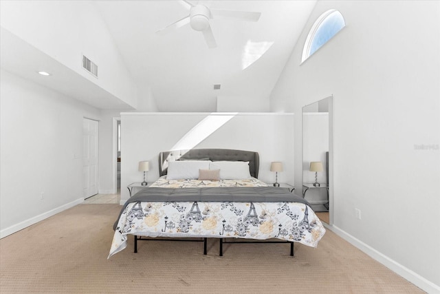 carpeted bedroom featuring ceiling fan and high vaulted ceiling