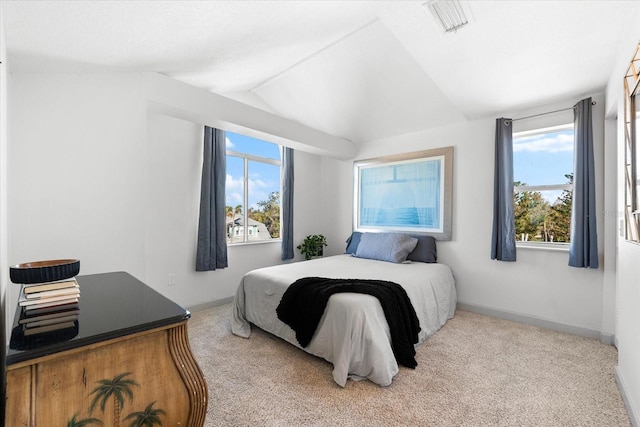 carpeted bedroom featuring vaulted ceiling