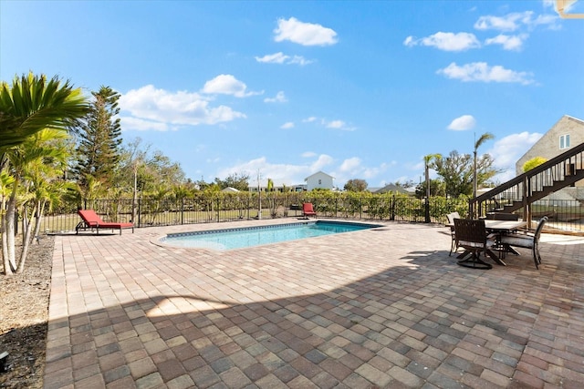 view of swimming pool featuring a patio area