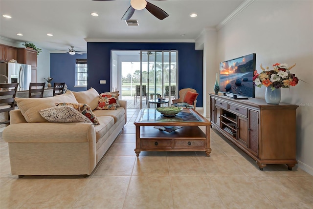 tiled living room with ceiling fan and ornamental molding