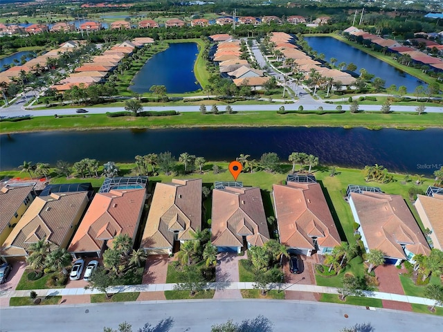 drone / aerial view with a water view