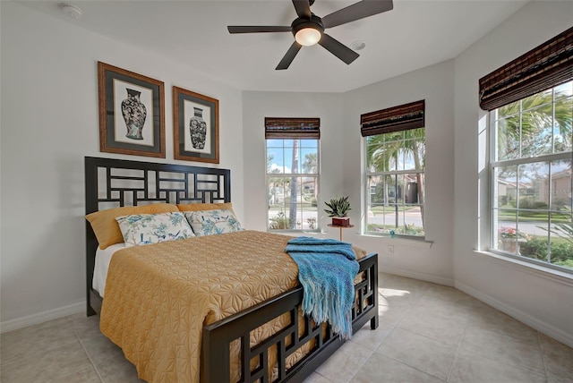 bedroom featuring ceiling fan and light tile patterned flooring