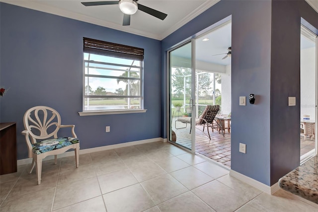 living area with light tile patterned floors, a wealth of natural light, crown molding, and ceiling fan