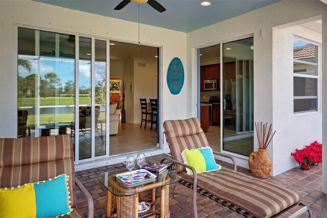 view of patio / terrace featuring ceiling fan