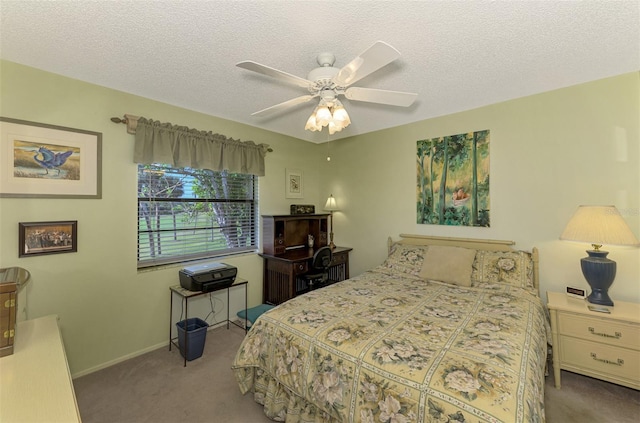 carpeted bedroom with a textured ceiling and ceiling fan