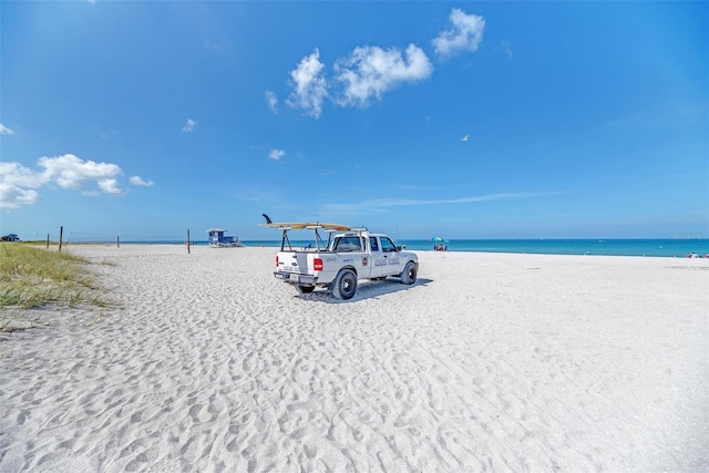 property view of water featuring a beach view