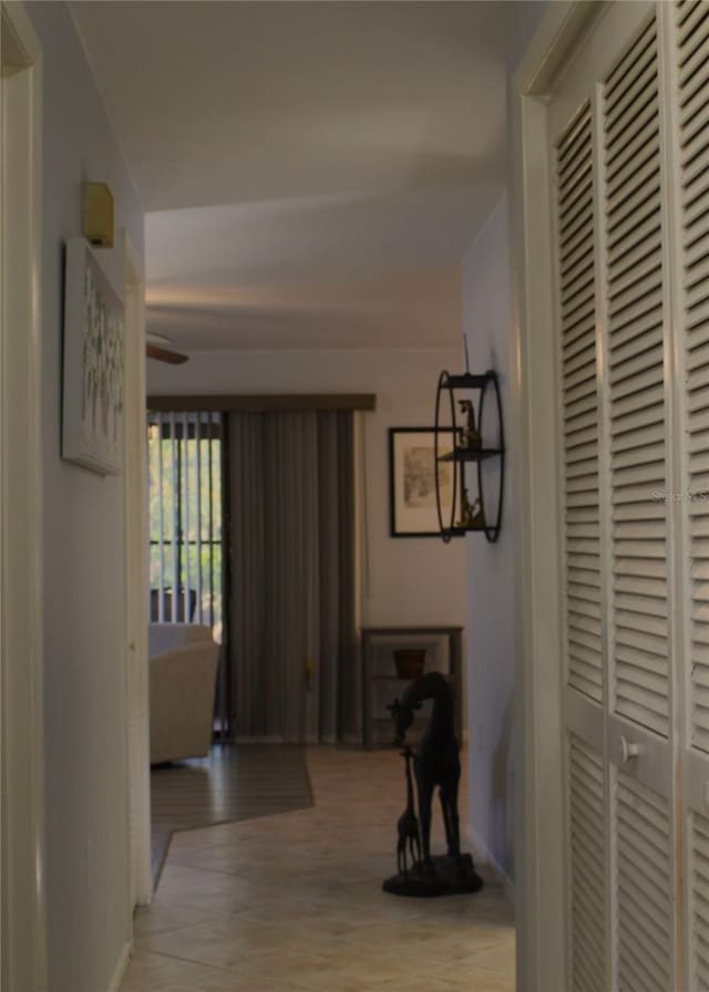 corridor with light tile patterned flooring