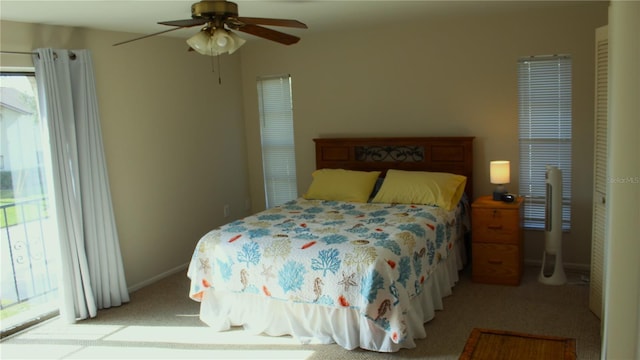 bedroom with ceiling fan and light colored carpet