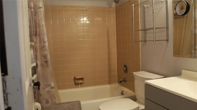 full bathroom featuring toilet, vanity, and shower / tub combo with curtain