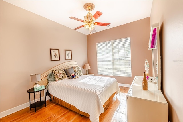 bedroom featuring light wood-type flooring and ceiling fan