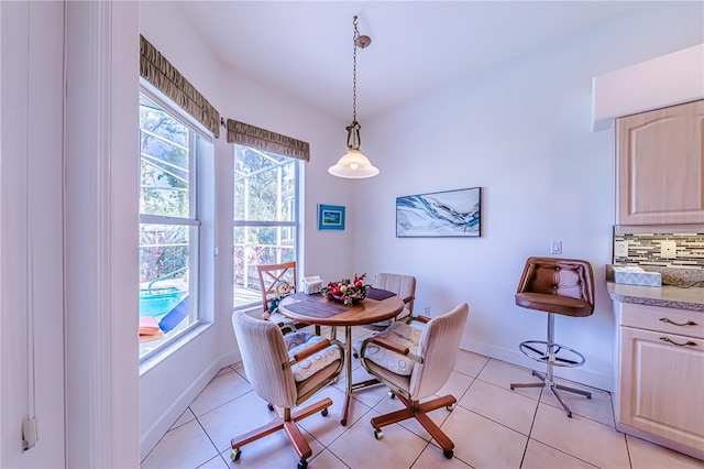 dining space featuring light tile patterned flooring