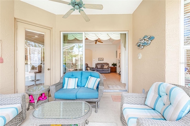 sunroom with ceiling fan