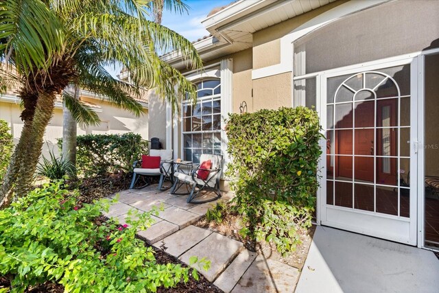 doorway to property featuring a patio