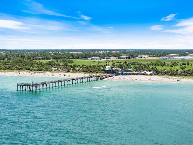 drone / aerial view with a beach view and a water view