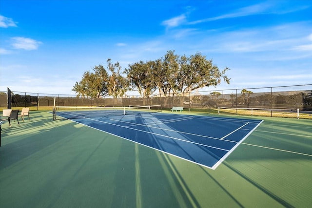 view of sport court featuring basketball hoop