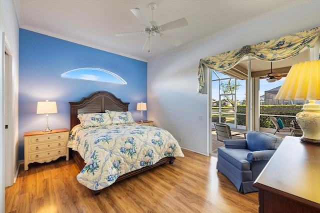 bedroom featuring hardwood / wood-style floors, ceiling fan, and ornamental molding