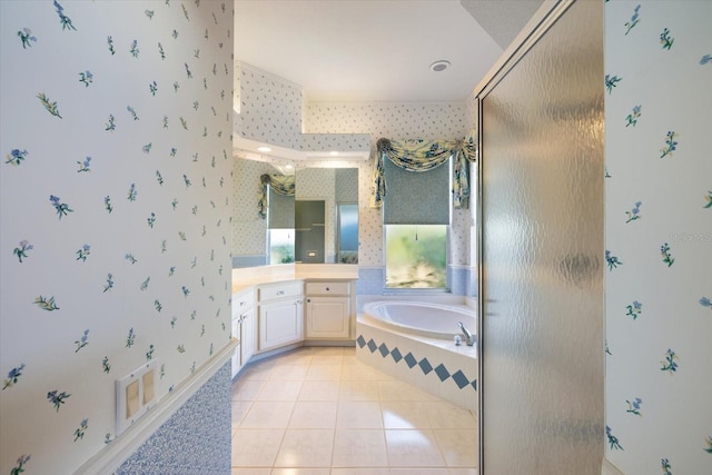 bathroom featuring vanity, plus walk in shower, and tile patterned floors