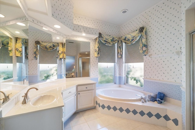 bathroom featuring independent shower and bath, tile patterned flooring, and vanity