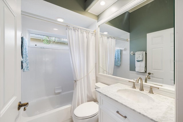 full bathroom featuring toilet, vanity, and shower / bath combination with curtain