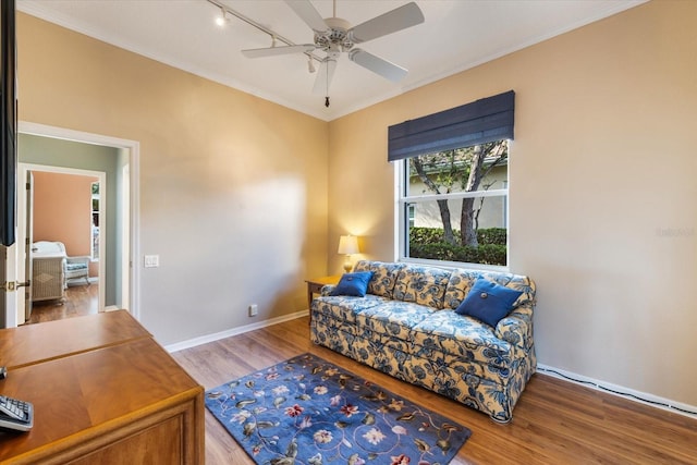 interior space featuring hardwood / wood-style floors, ceiling fan, and ornamental molding