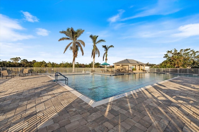 view of swimming pool featuring a patio area