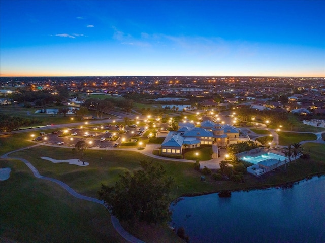 aerial view at dusk with a water view