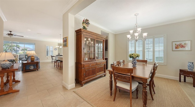 tiled dining space with crown molding, plenty of natural light, and ceiling fan with notable chandelier