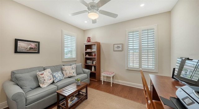 office with ceiling fan and hardwood / wood-style flooring