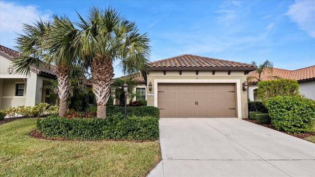 mediterranean / spanish-style house with a garage and a front yard