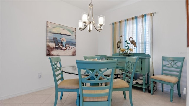 dining room featuring light tile patterned floors and an inviting chandelier