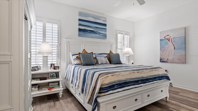 bedroom featuring dark hardwood / wood-style flooring and ceiling fan