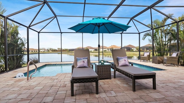 view of swimming pool with a lanai, a patio, and a water view