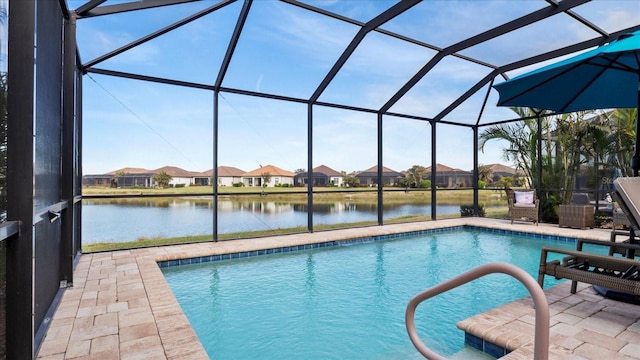 view of swimming pool with a water view, a patio area, and a lanai