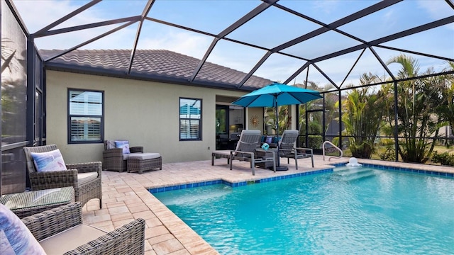 view of pool with a patio and a lanai