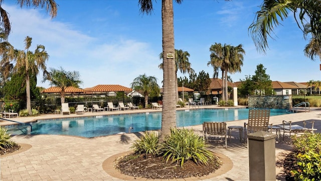 view of swimming pool featuring a patio area