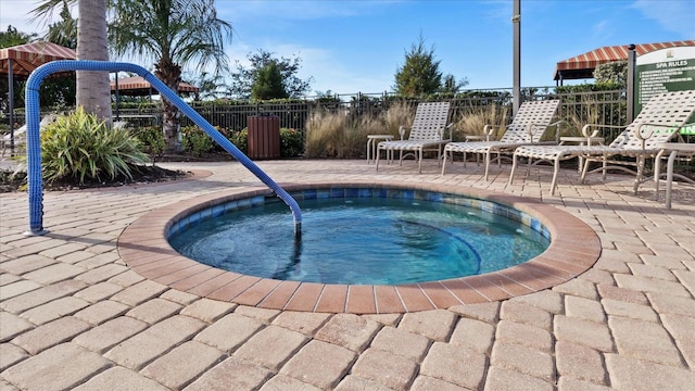 view of swimming pool with a community hot tub and a patio