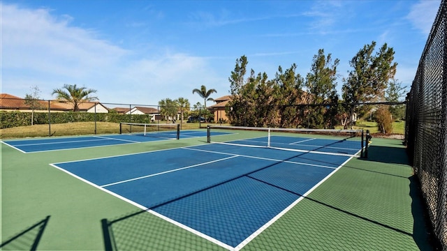 view of sport court with basketball hoop