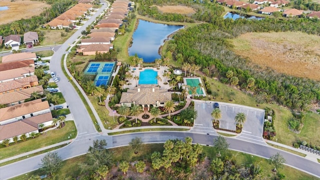 birds eye view of property with a water view