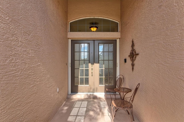 property entrance featuring french doors