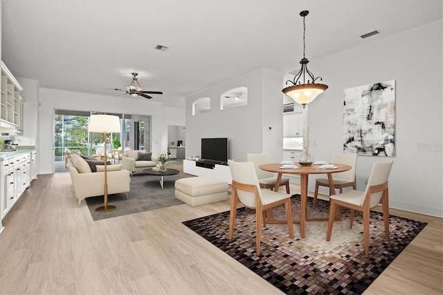 dining space featuring light hardwood / wood-style floors and ceiling fan