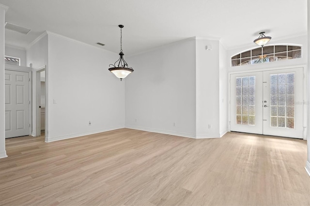 interior space featuring crown molding, french doors, and light hardwood / wood-style flooring