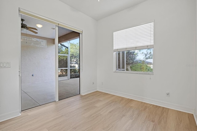 unfurnished room featuring ceiling fan and light hardwood / wood-style floors