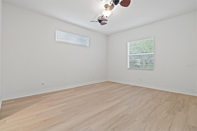 spare room with light wood-type flooring